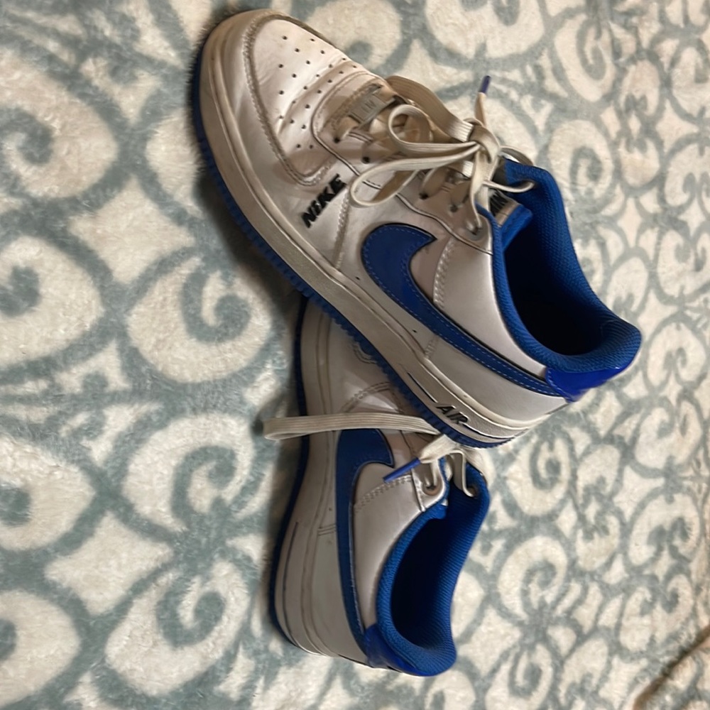 White and blue Nike Airs.